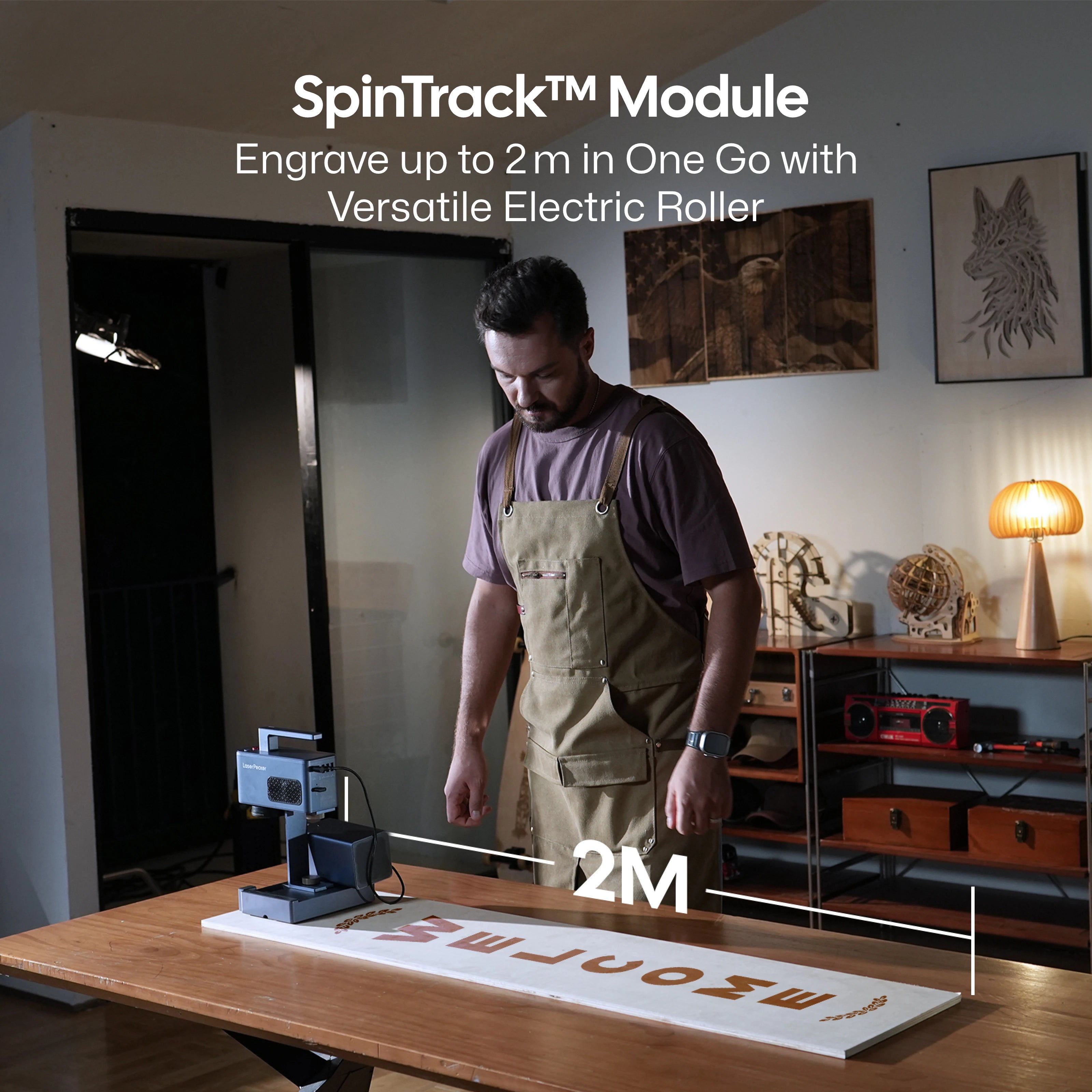 LaserPecker LP2 Plus SpinTrack™ Module, featuring a versatile electric roller that enables engraving up to 2 meters in a single pass, demonstrated on a long wooden workpiece.