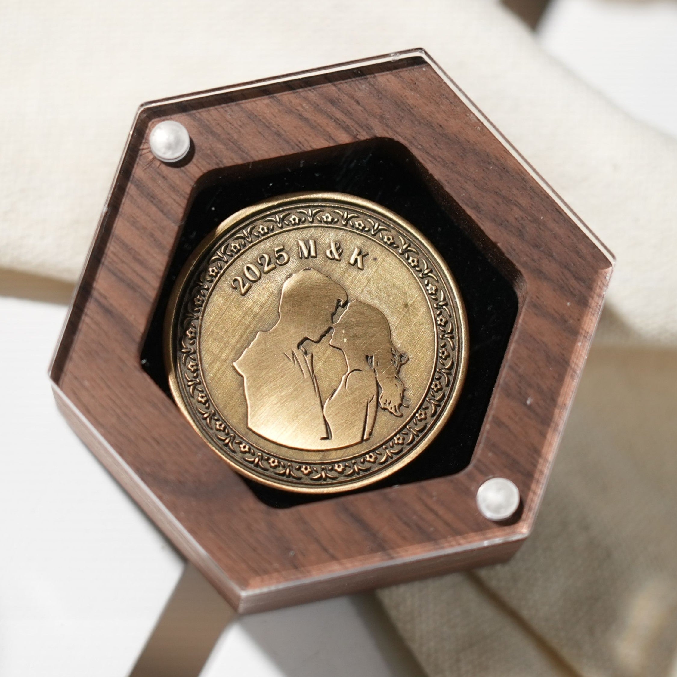 blank brass coins in display box for laser engraving custom award set for military corporate recognition.