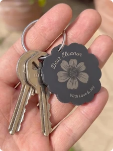 Detailed text engraved on a TPU keychain tag.
