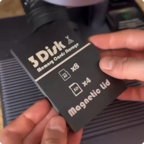 A Maker using LaserPecker LP4 to engrave a custom logo onto a 3D printed black PLA SD card box