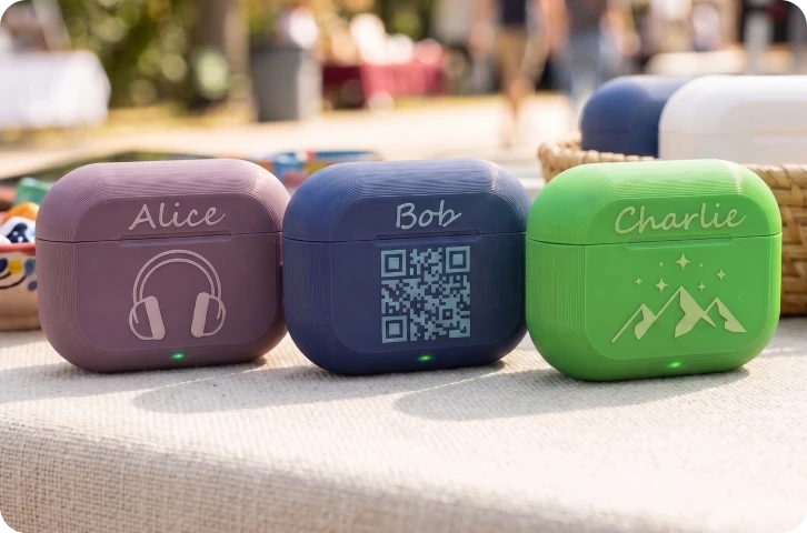 Close-up of laser engraving showcasing high-precision QR codes and text on 3D printed earphone cases