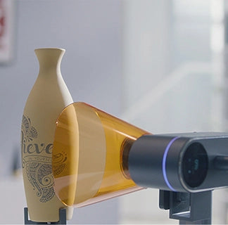 LaserPecker LP4 laser unit rotated with Rotary Extension for bottle engraving.