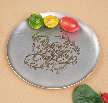 LaserPecker LP4 intricate laser etching on a metal serving platter.