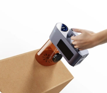 Handheld LaserPecker LP4 engraving on a large surface at a flexible angle.
