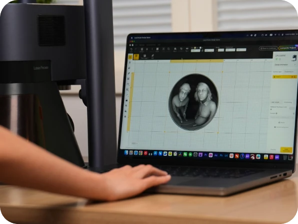 Laptop screen displaying the LaserPecker Design Space software interface, with a "Merry Christmas" coin engraving design in progress – part of LaserPecker LP5's "Design, Preview, and Execute" workflow.