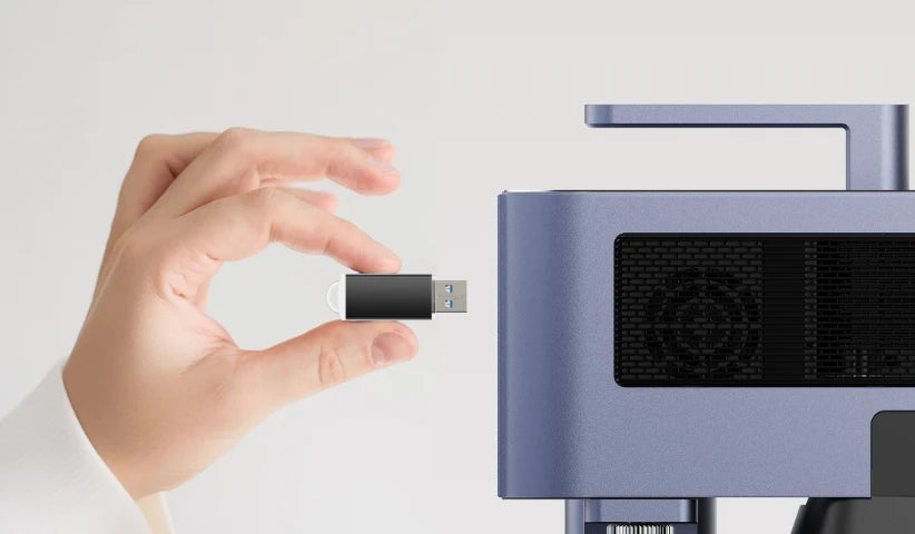 Hand inserting a USB drive into the LaserPecker LP5 laser engraver, demonstrating the offline processing feature (USB drive offline operation) under the "Intuitive, Zero-Fuss Workflow" theme – enabling cable-free, repeatable jobs.