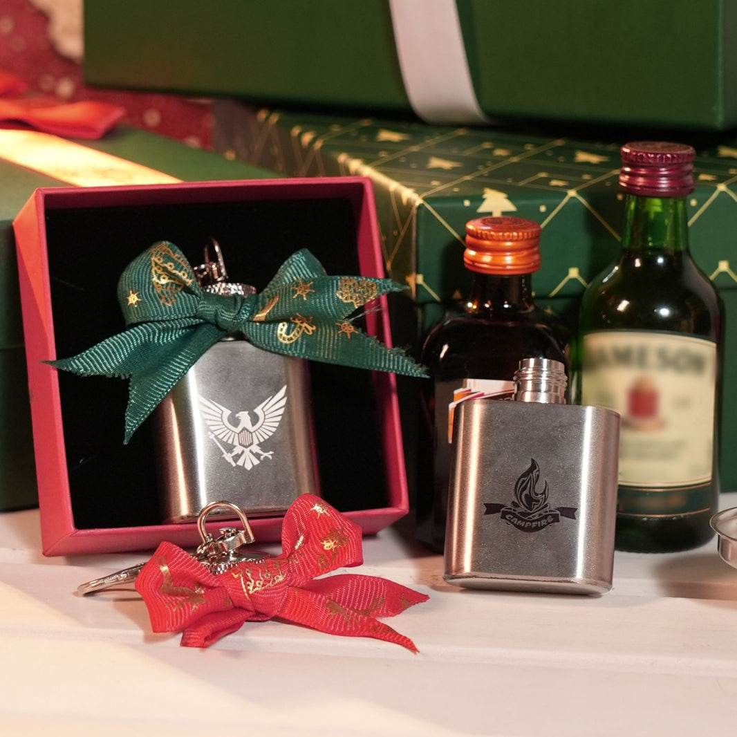 1 oz mini stainless steel flask keychain with custom laser engraved text and designs.

