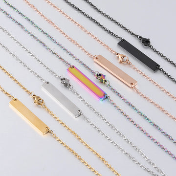 5 stainless steel horizontal bar necklace blanks scattered for laser engraving bulk order jewelry making.