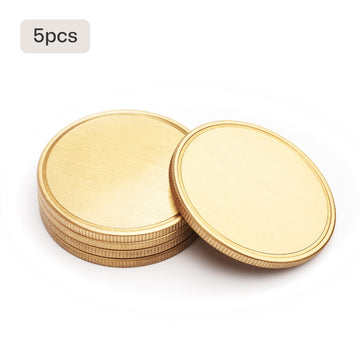 5 blank brass coins stacked for laser engraving bulk order for military units corporate awards.
