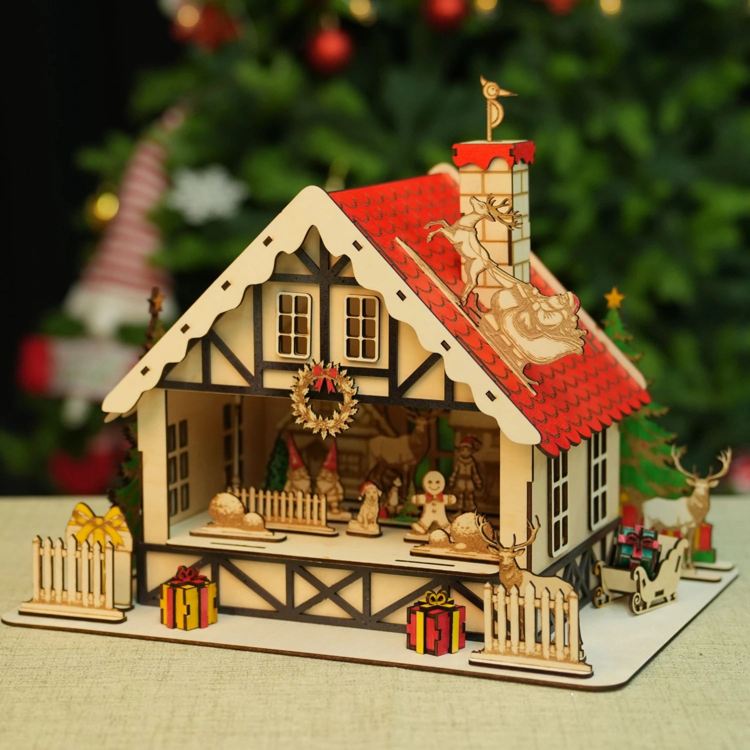 Laser cut wooden Christmas cabin from 3mm basswood plywood sheet.