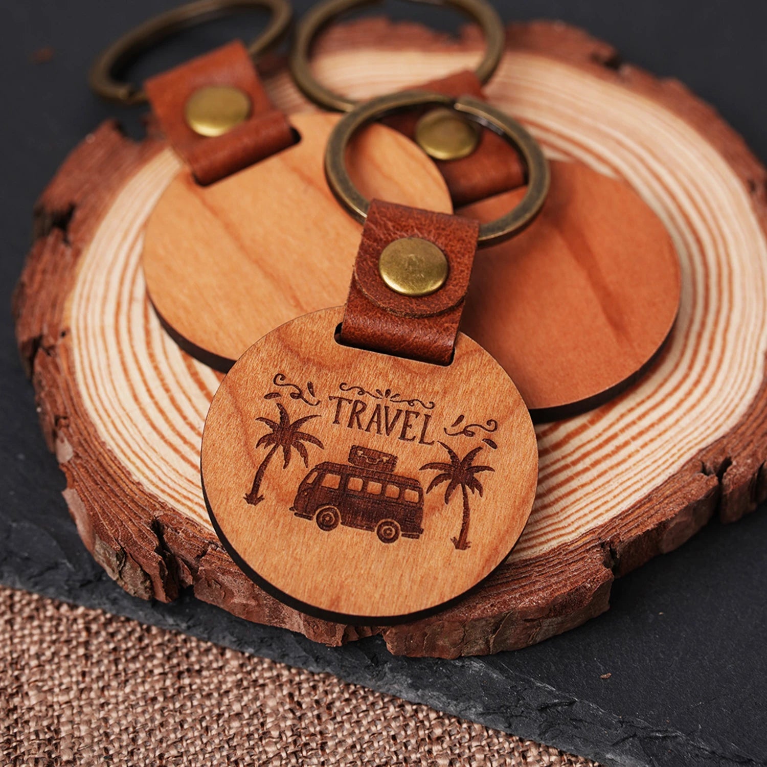 cherry wood circular keychain with laser engraved name and heart for personalized gift.