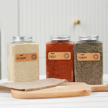 laser engraved corkwood labels applied on glass jars for pantry organization diy craft project.
