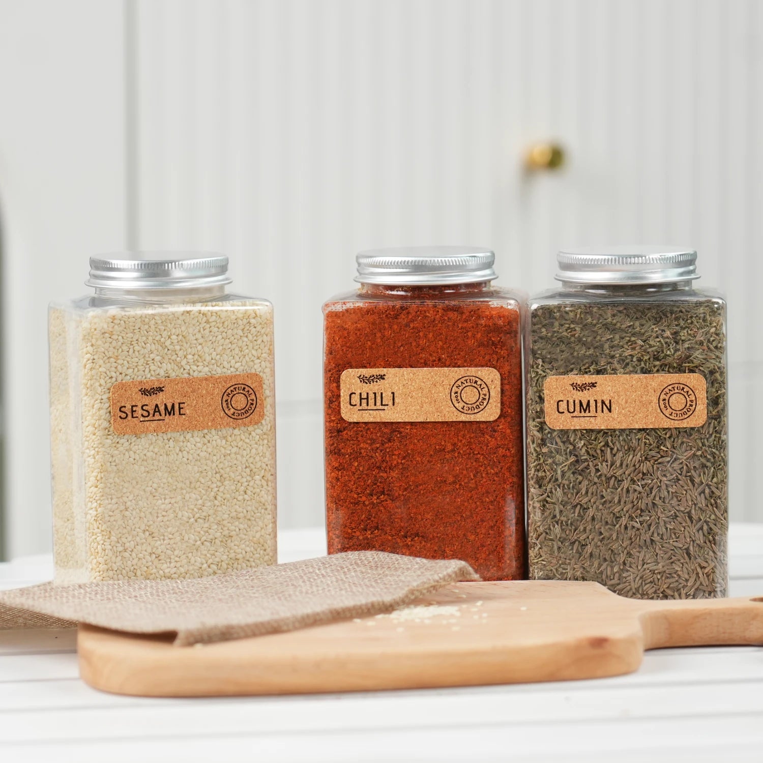 laser engraved corkwood labels applied on glass jars for pantry organization diy craft project.