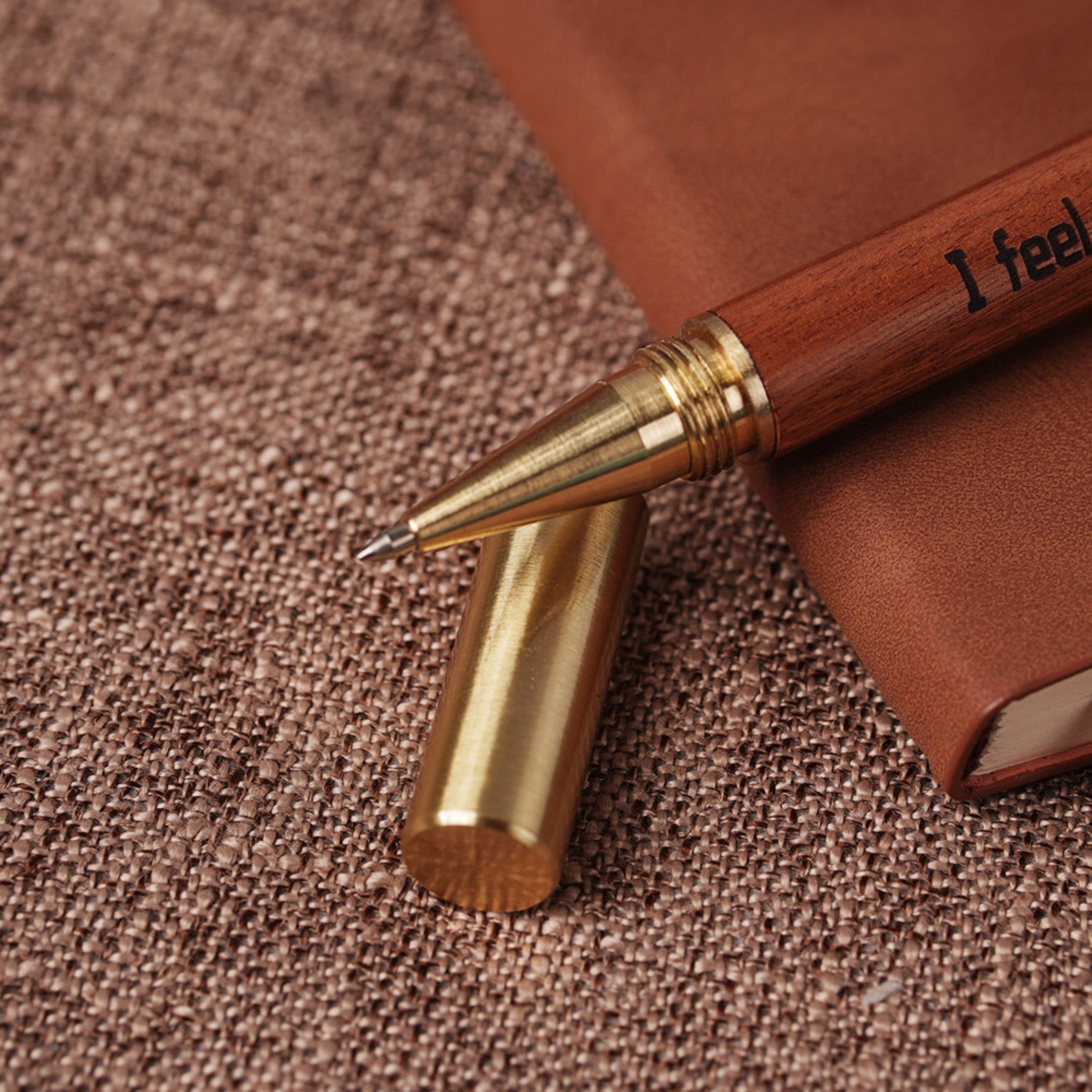 close up of rollerball pen tip on wooden pen blank for laser engraving smooth writing instrument.