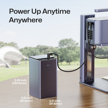 LaserPecker portable power bank in an outdoor setting, dimensions 150 by 82 millimeters.

