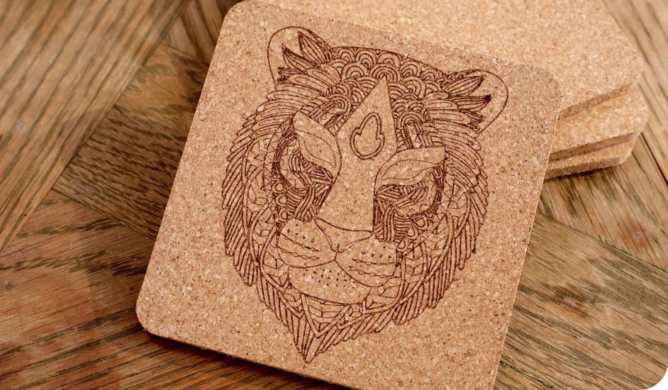 LaserPecker LP2 Plus 10W engraving custom patterns, pet portraits, and monograms on cork coasters for personalized drinkware accessories, housewarming gifts, and coffee table decor.
