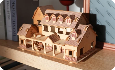 LP2 Plus engraving and cutting 3D wooden house puzzle pieces on basswood.