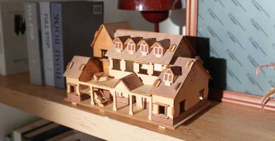 LP2 Plus engraving and cutting 3D wooden house puzzle pieces on basswood.