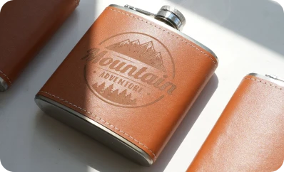LP2 Plus engraving custom design on leather flask cover.