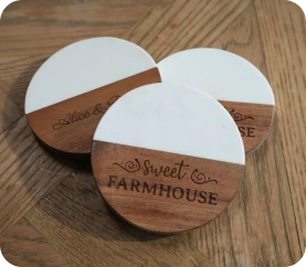 LP2 Plus engraving decorative design on wooden coaster.