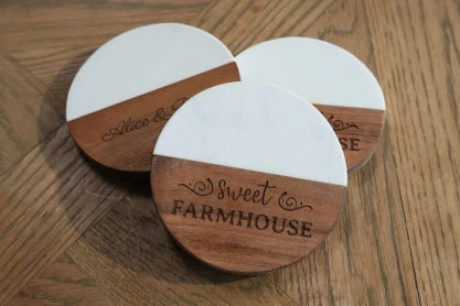 LP2 Plus engraving decorative design on wooden coaster.