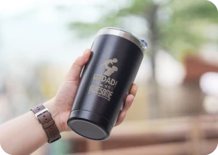 LaserPecker LP2 Plus with rotary extension engraving custom logo and name on coated stainless steel tumbler, 10W laser removes coating for high-contrast permanent marking.