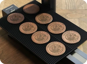 LaserPecker LP2 Plus with slide extension batch engraving multiple leather patches and labels for branding, custom logos, and leather craft projects.